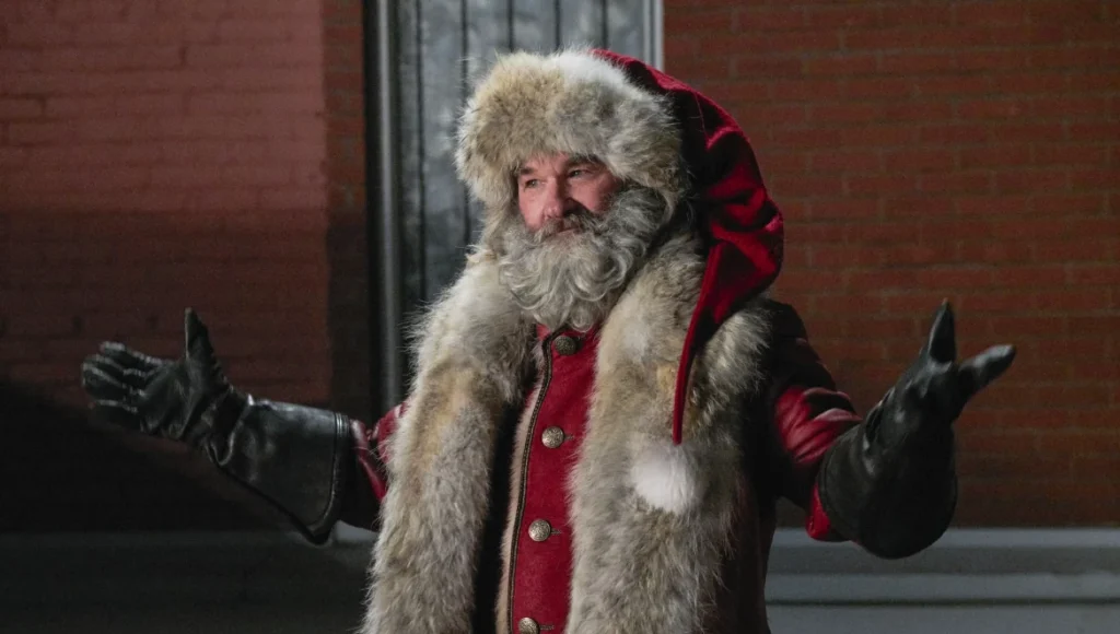 a man wearing a fur coat and holding his arms out